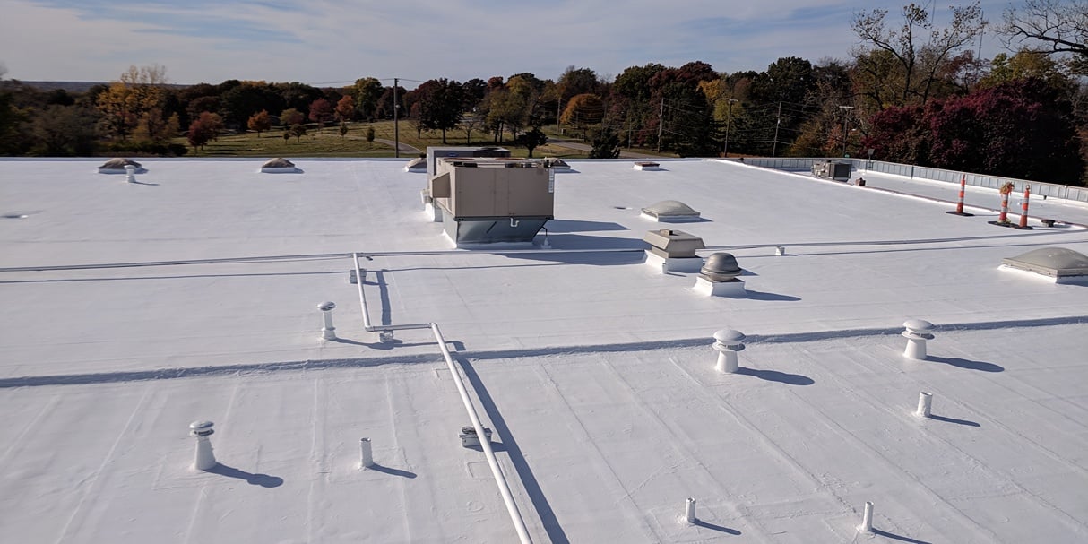 elastomeric roof coating on a commercial roof